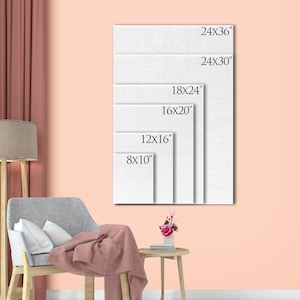 May include: A selection of canvas art prints in different sizes, including 20x25 cm, 30x40 cm, 40x50 cm, 45x60 cm, 60x76 cm, and 60x91 cm. The prints are displayed against a peach wall, with a chair, blanket, and lamp in the foreground.