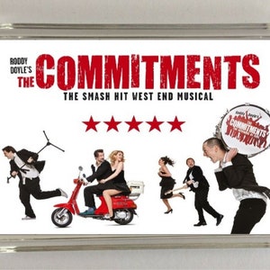 May include: A white magnet featuring a red and white image of a band playing music. The text "Roddy Doyle's The Commitments The Smash Hit West End Musical" is at the top of the magnet. There are five red stars below the text.