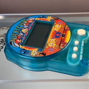 Epoch 1990s Alien Fever, Small LCD Game, Sounds, Moving Screen Game, No Manual, Retro 90s Toy, Blue Translucent Shell, English
