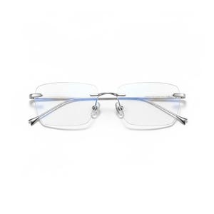 May include: Rimless eyeglasses featuring a thin, polished silver-tone metal frame. The rectangular lenses are clear with a subtle blue-tinted reflection. The bridge and temples are slender, connecting to the lenses with small metal hardware.