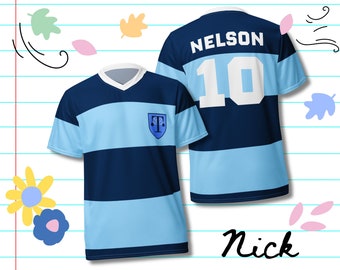 May include: Two blue and light blue sports jerseys. The front jersey has a V-neck and a crest. The back jersey has the name "NELSON" and the number "10". The name "Nick" is written in cursive at the bottom.
