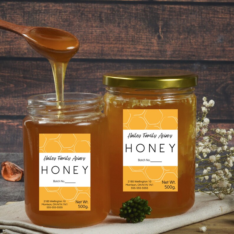 Honey Labels with yellow background and honeycomb image. Black lettering on a white background. Shown on honey jars.