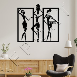May include: Three black silhouette figures of women in a framed wall art piece. The women are wearing traditional African clothing and are holding various objects. The art piece is made of metal and has a black finish.