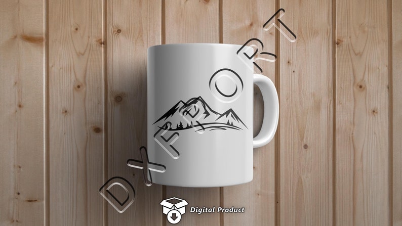 May include: White ceramic mug with a black silhouette of mountains and trees. The mug has a handle and is on a wood background.