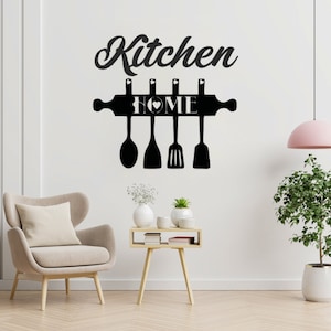 May include: Black and white kitchen wall decor with the word "Kitchen" and a rolling pin with the word "HOME" and a heart. Five kitchen utensils hang from the rolling pin.