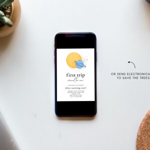 May include: A digital invitation for a first birthday party with a space theme. The invitation features a yellow sun with a blue planet and a ring around it. The text on the invitation reads "first trip around the sun" and "Alex turning one!"