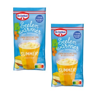 May include: Two blue and white Dr. Oetker packages of "Seelenwärmer" lemon cheesecake style pudding. Each package features a yellow cup with pudding, a slice of cake, and the text "Summer Edition".