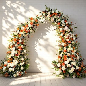 May include: A large, arched floral arrangement featuring a dense mix of white and burnt orange roses, lilies, and assorted greenery. The flowers are clustered together to form a semi-circular shape, creating a decorative display for events.