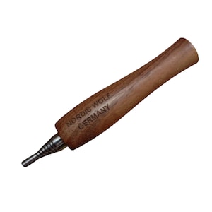 May include: A wooden smoking pipe with a metal mouthpiece and a telescopic extension. The pipe is engraved with the text "NORDIC WOLF GERMANY".