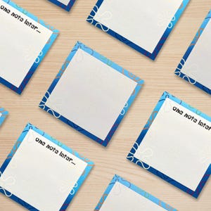May include: A set of six blue and white patterned sticky notes with the text "one note later..." on some of the notes.