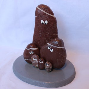 Groups of six figures in natural pebbles.