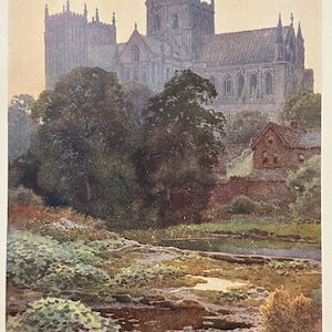 Pode incluir: Uma pintura a aquarela de uma grande catedral de pedra com um rio em primeiro plano. A catedral é cinza e tem muitas janelas. O rio é marrom e tem plantas verdes crescendo nas margens.