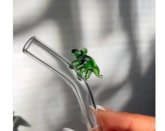 Glass straw with a mini Green Dino on top