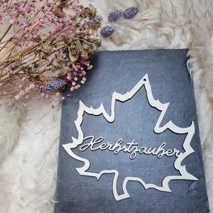 Autumn wreath in leaf shape with the lettering Autumn magic, wooden door wreath, simple autumn decoration, wooden loop