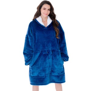 May include: A blue oversized hooded blanket with a white fleece-lined hood. The blanket features a large front pocket and a button closure. The soft, plush material provides warmth and comfort. The blanket is designed for lounging and relaxation.