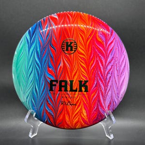 May include: A set of three ceramic mugs with a speckled, matte finish. Each mug features a different color: light blue, cream, and gray. The mugs have a simple, modern design with a rounded shape and a comfortable handle.