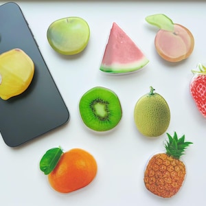 Charming Fruit-Themed Phone Grips | Assorted Fruit Styles | Universal Fit Phone Holders - Add a Refreshing Twist Today