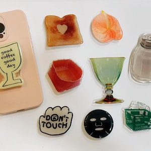 Charming Fruit-Themed Phone Grips | Assorted Fruit Styles | Universal Fit Phone Holders - Add a Refreshing Twist Today
