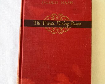 May include: A hardcover book titled "The Private Dining Room" by Ogden Nash. The book has a red cover with gold lettering and a dark brown band across the middle. The book is slightly worn.