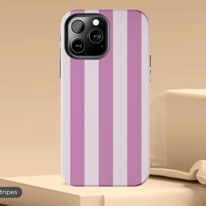 May include: A phone case for an iPhone with purple and white stripes.