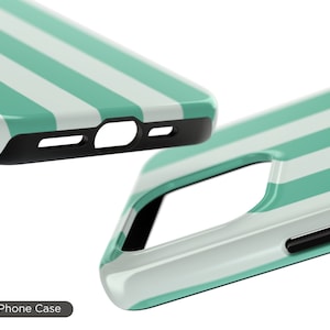 May include: A tough phone case with a white and teal striped design. The case is made of durable plastic and has a raised lip to protect the screen.