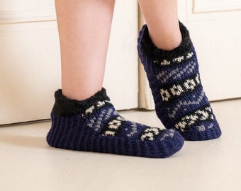 May include: Pair of blue and white patterned slipper socks with a black fluffy cuff.