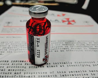 May include: A small glass vial with a silver cap, filled with a red liquid containing black strands. The label reads "UMBRELLA CORPORATION" and "NE-a TYPE". The vial sits on a document with printed text.