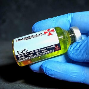 May include: A vial of yellow liquid labelled "ELPIS" from "Umbrella Corporation." The label includes the text "[PANDORA, ARK] [All Purpose Antiviral] Sample - C8901 30ml ~8500iu" and a biohazard symbol. The vial is held by a person wearing blue gloves.
