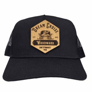 May include: Black trucker hat with a brown hexagonal patch that says "Dream Cruise" with a vintage car illustration and the text "Woodward Detroit MI"