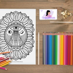 May include: A black and white colouring page featuring a mandala with an eye in the centre. The mandala is surrounded by a circle of leaves. The page is titled "New Moon Mandala".