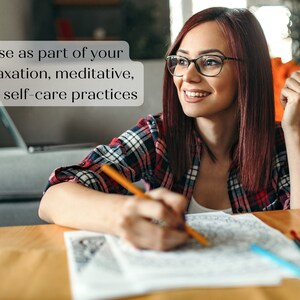 May include: A woman wearing glasses and a checked shirt is colouring in a colouring book with a pencil. The text "Use as part of your relaxation, meditative, and self-care practices" is visible in the image.