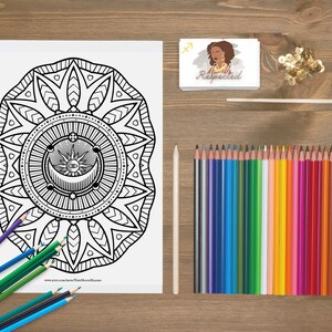 May include: A black and white colouring page featuring a mandala design with a sun, moon, and eye in the centre. The mandala is surrounded by a border of leaves and flowers. The page is titled "New Moon Magic".
