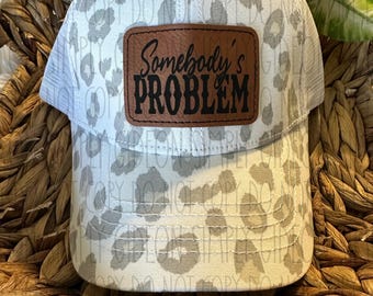 Somebody&#39;s Problem Trucker Hat: Leopard Print Ponytail, Adult Humor