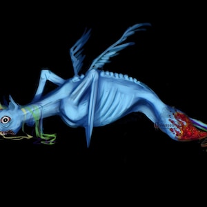 May include: A digital painting of a blue skeletal creature with wings, a horse-like head, and a long body. The creature has a red and rainbow-colored tail and is set against a black background. The word "UniverseDesign" is in the bottom right corner.