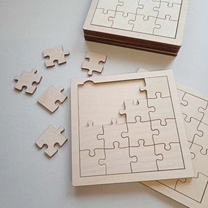 May include: A set of unfinished wooden jigsaw puzzles. The puzzles are made of natural wood and have a smooth surface. The puzzles are in various sizes and shapes. The puzzles are perfect for a craft project or for a fun activity for children.