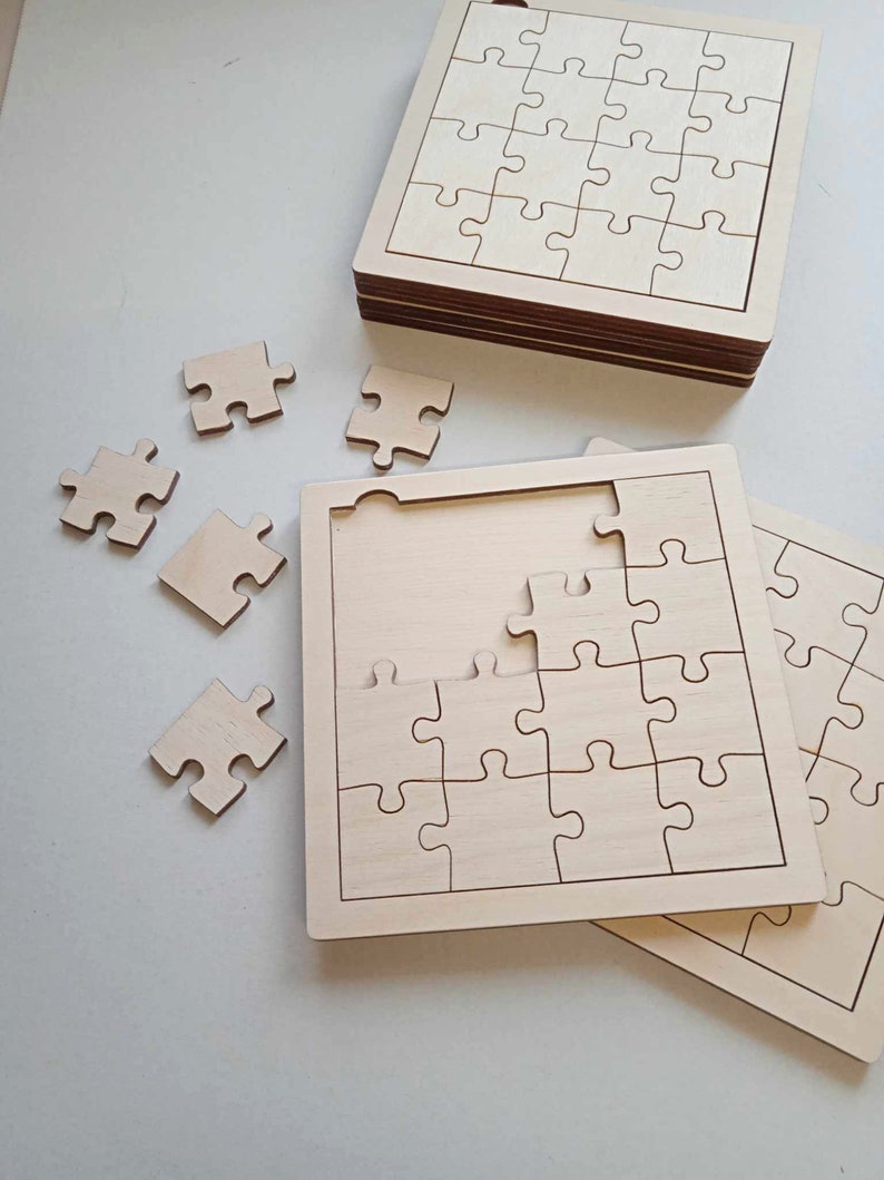 May include: A set of unfinished wooden jigsaw puzzles. The puzzles are made of natural wood and have a smooth surface. The puzzles are in various sizes and shapes. The puzzles are perfect for a craft project or for a fun activity for children.