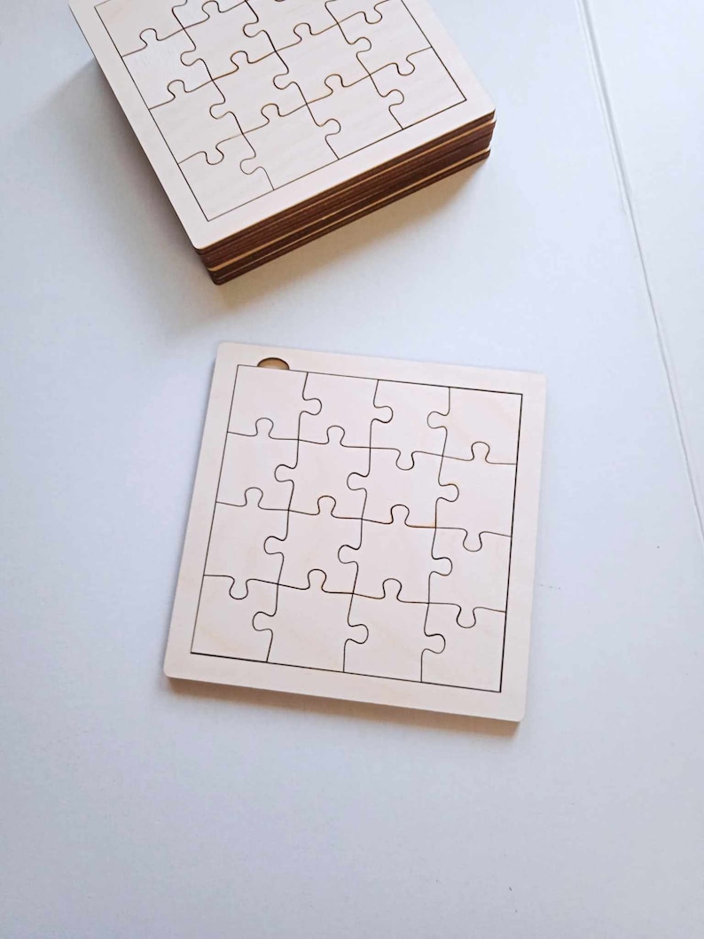 May include: Two unfinished wooden jigsaw puzzles, each with 25 pieces. The puzzles are blank and ready to be painted or decorated.