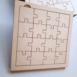 May include: A wooden jigsaw puzzle with 25 pieces, ready to be assembled. The puzzle is made of light brown wood and has a smooth, unfinished surface.