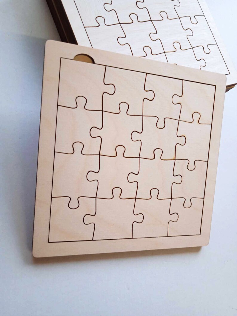 May include: A wooden jigsaw puzzle with 25 pieces, ready to be assembled. The puzzle is made of light brown wood and has a smooth, unfinished surface.