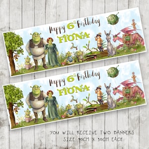 May include: Two rectangular banners featuring Shrek characters including Shrek, Fiona, Donkey, Puss in Boots, and a dragon. The text reads Happy 6th Birthday FIONA. Each banner measures 90 cm x 30 cm, set against a light blue sky and green meadow.