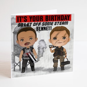 May include: Birthday card featuring cartoon illustrations of two figures. The card's text reads "IT'S YOUR BIRTHDAY SO LET OFF SOME STEAM BENNETT". One character holds a smoking object, the other a gun and a briefcase. The background is grey.