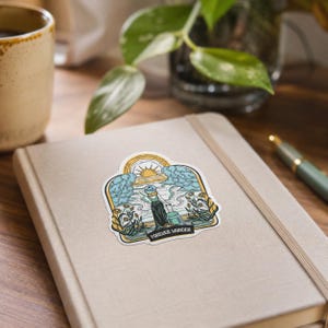 May include: A die-cut sticker featuring a colorful illustration of a person with a hat and suitcase standing before a sunset, clouds, and flowers. The design includes a black banner at the bottom with the white text FOREVER WANDER.