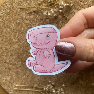 Rosa Plüsch TRex Aufkleber Niedlicher Dinosaurier Aufkleber Niedlicher Plüschtieraufkleber Pastellfarbener Aufkleber Rosa Aufkleber - Matte Oberfläche