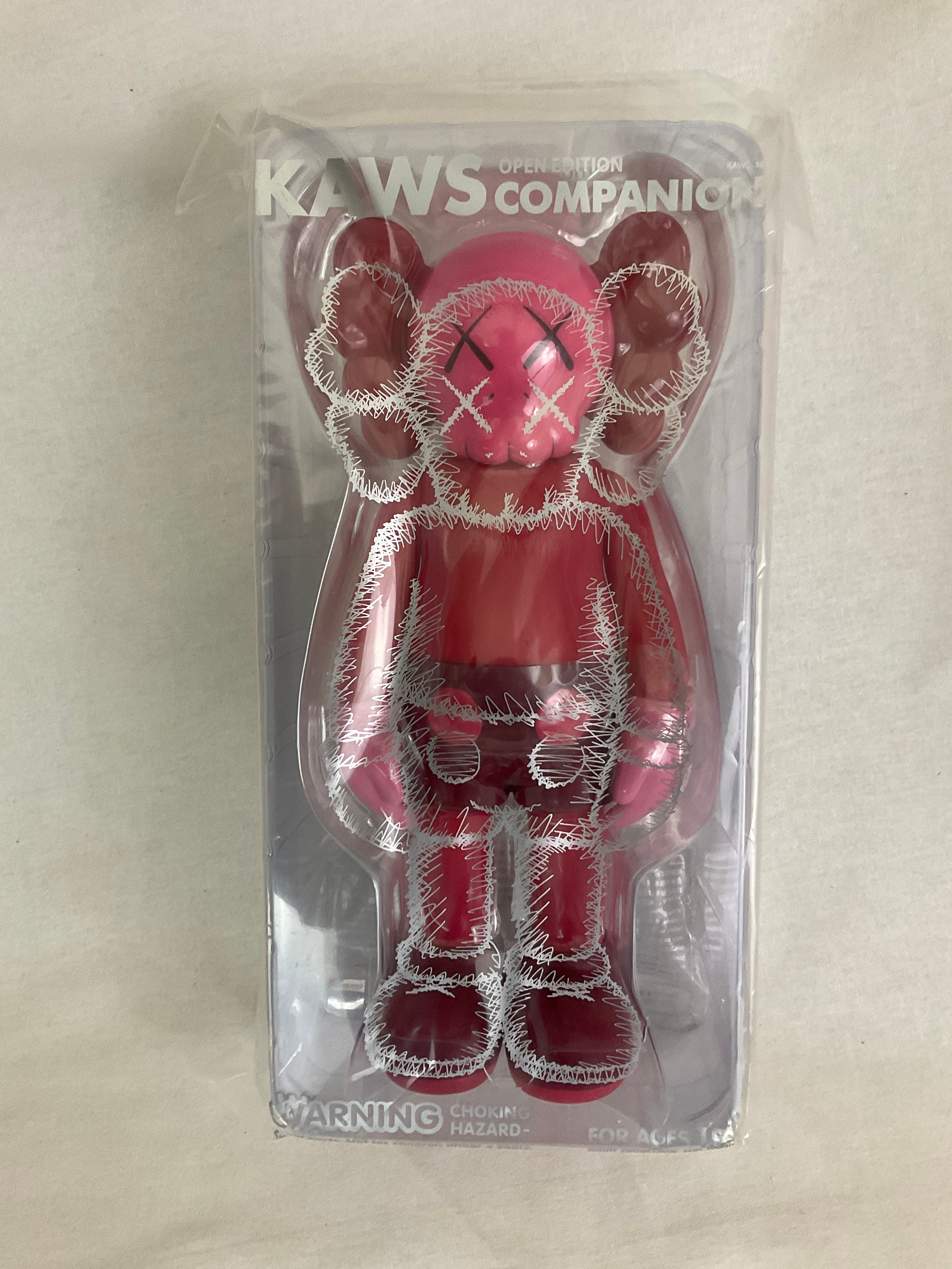 KAWS: open edition keychain.