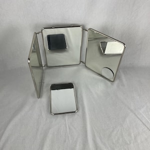 old barber hairdresser triptych mirror in nickel-plated metal and white imitation leather with its small vintage old French antique hand mirror