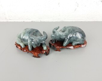 Pair of Chinese hand carved soapstone buffalos on wooden base