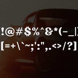May include: A dark, silhouetted sports car is visible in the background behind two lines of white text. The first line displays (!@#$%^&*(-_|). The second line displays {[=+`~;':",.<>/?]} in a bold, sans-serif font style.