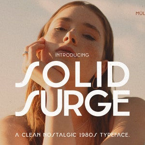 May include: A retro-style font called "Solid Surge" with a clean, nostalgic 1980s typeface. The font is displayed in white against a warm, textured background.