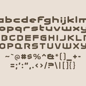May include: A full alphabet and symbols in a bold, geometric font. Uppercase and lowercase letters are displayed in a dark brown colour against a light beige background. The words "Studio Basics" are in a circular logo in the upper right corner.