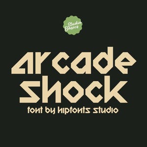 May include: A graphic design featuring the words "Arcade Shock" in a bold, geometric font. Below the main text is "font by hiptonts studio." A green, circular logo with the words "Studio Basics" is at the top.
